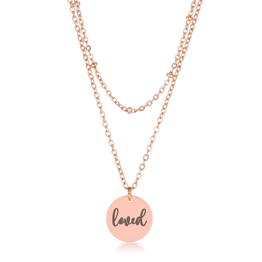 This classy necklace features a simple oval pendant inscribed with LOVED hanging from a cable chain. An inner saturn chain adds sophistication to-0