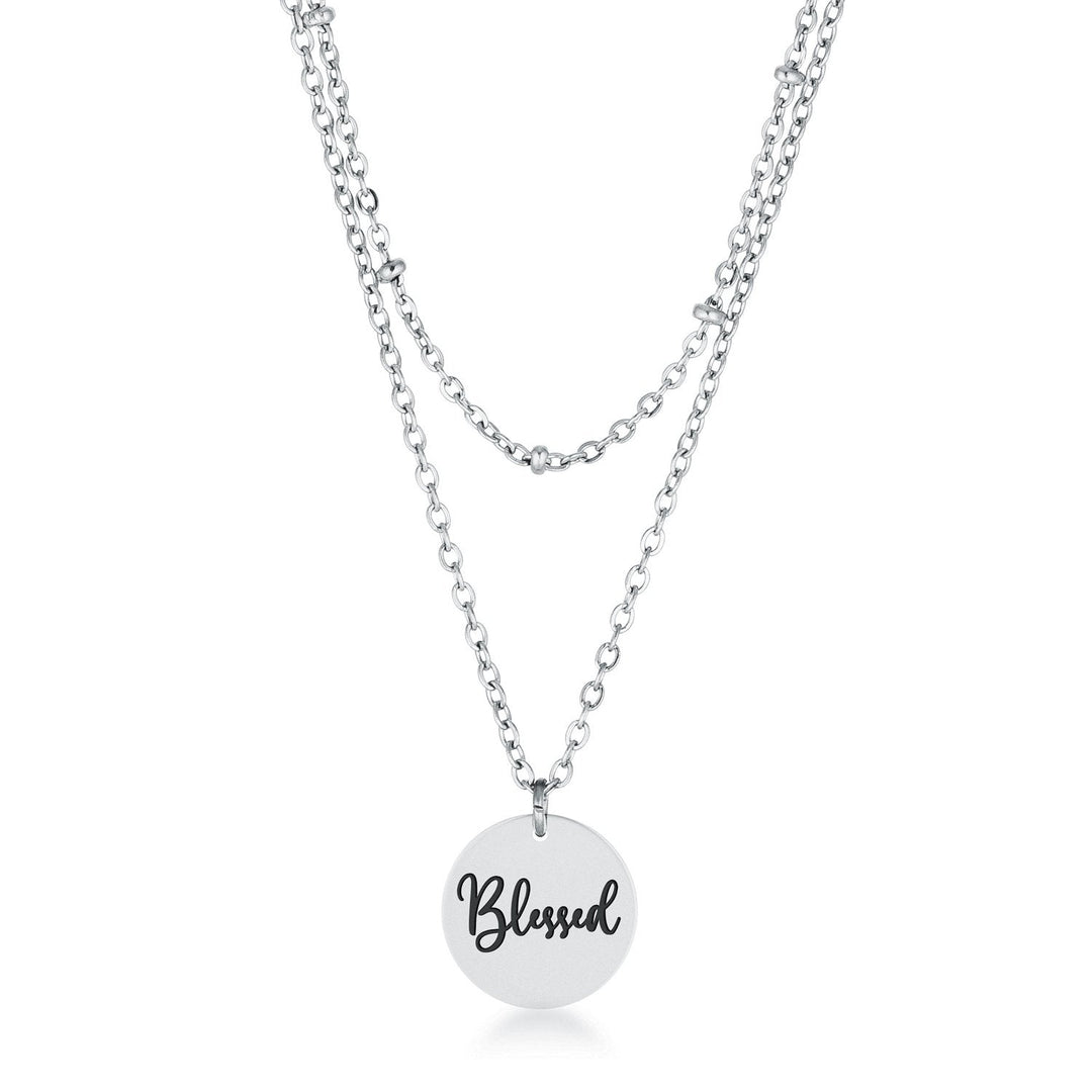 This classy necklace features a simple oval pendant inscribed with BLESSED hanging from a cable chain. An inner saturn chain adds sophistication to-0